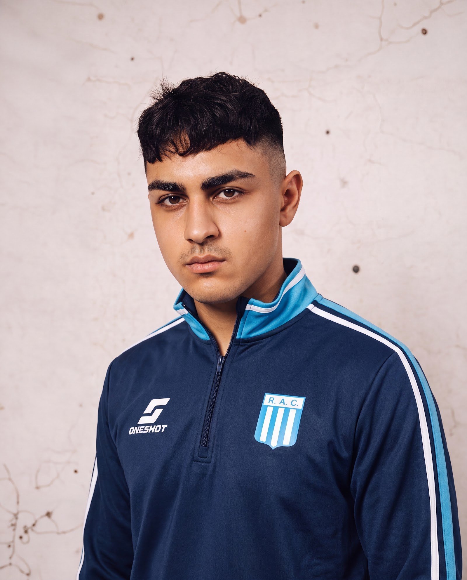 Buzo medio cierre oficial de Racing La Madrid